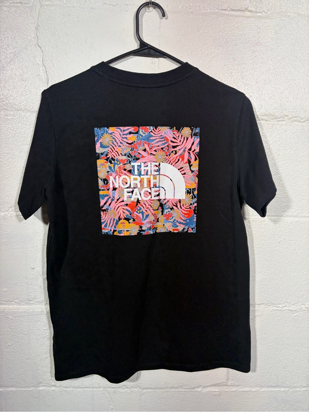 The North Face Black Short-Sleeve Tee with Colorful Tropical Logo
